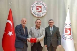 BŞEÜ’ye gümüş madalya ve madalya beratı takdimi 