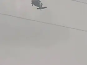 Askeri helikopter dolu ve yağmura yakalandı
