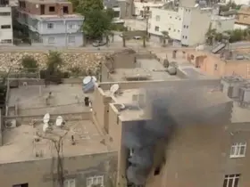 Mardin’de binada çıkan yangında mahsur kalan 2 kişi kurtarıldı
