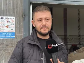 Sel sularında mahsur kalan anne kedi ve yavrularını esnaf kurtardı
