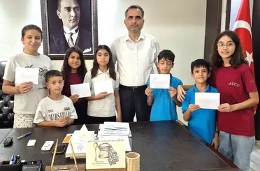 Kozan’da miniklerden afetzedelere 15 bin liralık destek